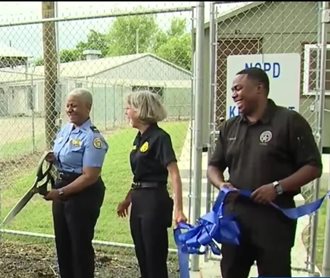 nopd superintendent kirkpatrick with officers and k9 ribbon cutting