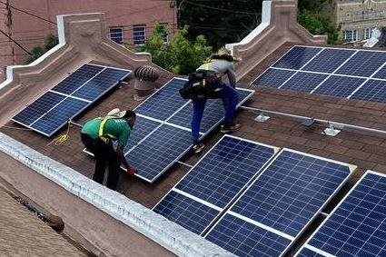 Solar panel installers at work