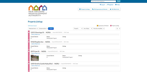 Screenshot of property listing with addresses, image of lot, and statuses